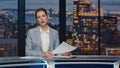 Female newscaster reporting news late night studio closeup. Woman broadcasting Royalty Free Stock Photo