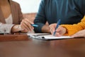 Female notary working with mature couple, closeup Royalty Free Stock Photo