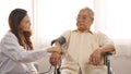 Female nurse doctor in uniform health check measuring blood pressure senior grandfather patient Royalty Free Stock Photo