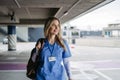 Nurse, doctor walking across hospital parking lot, going home from work. Work-life balance of healthcare worker. Royalty Free Stock Photo