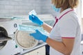 Female nurse doing sterilization of dental medical instruments in autoclave Royalty Free Stock Photo