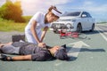 Female nurse helping emergency CPR to asia cyclist injured