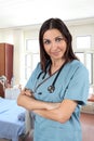 Female nurse in hospital room Royalty Free Stock Photo