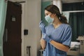 Female nurse with a mask putting on gloves Royalty Free Stock Photo