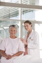 Female nurse performing checkup