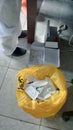 A female nurse's feet and medical equipment trash on the floor.
