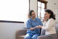 Female nurse visit old grandmother patient at home listen to complains concerns, attentive young woman doctor consulting Royalty Free Stock Photo