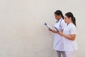 Female nurses using digital tablet in hospital corridor Royalty Free Stock Photo