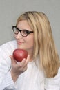 Female offering an apple Royalty Free Stock Photo