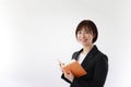 Female office worker with a schedule book Royalty Free Stock Photo