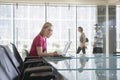 Female Office Worker Using Laptop In Conference Room Royalty Free Stock Photo