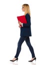 Female Office Worker Is Walking With Clipboard