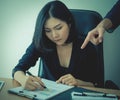 Female office worker working under pressure from supervisor Royalty Free Stock Photo