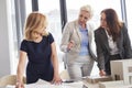 Female office workers having consultations about strategy