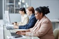 Female Office Workers Using Company Computers Royalty Free Stock Photo