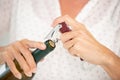 female opening wine bottle Royalty Free Stock Photo