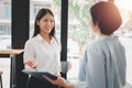 Female operations manager holds meeting presentation for a team of economists.