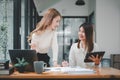 Female operations manager holds meeting presentation for a team of economists.