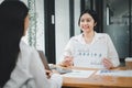 Female operations manager holds meeting presentation for a team of economists.