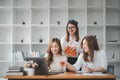 Female operations manager holds meeting presentation for a team of economists.