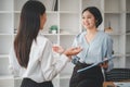 Female operations manager holds meeting presentation for a team of economists.