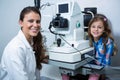 Female optometrist interacting with young patient Royalty Free Stock Photo