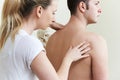 Female Osteopath Treating Male Patient With Shoulder Problem Royalty Free Stock Photo