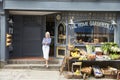 Female Owner Standing Next To Produce Display At Deli Royalty Free Stock Photo