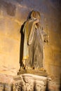 Female painted statue of Christian Saint in golden church light Royalty Free Stock Photo