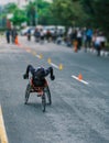 Female paralympic athlete doing wheelchair racing