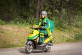 Female paramedics driving a motor scooter.