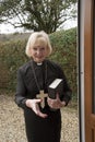 Female parish priest on a house call