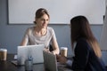 Female partners negotiating about future projects in office