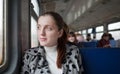 Female passanger sitting inside train