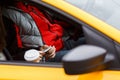 Female passenger giving dollar bill to the driver in taxi Royalty Free Stock Photo