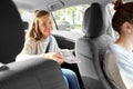 female passenger passing money to car driver Royalty Free Stock Photo