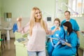 Female patien with three doctors at the dental office