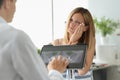 Female patient with acute toothache at doctor appointment with X-ray image Royalty Free Stock Photo