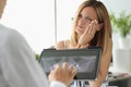 Female patient with acute toothache at doctor appointment with X-ray image Royalty Free Stock Photo