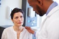 Female Patient Being Reassured By Doctor In Hospital Room Royalty Free Stock Photo