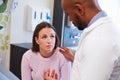 Female Patient Being Reassured By Doctor In Hospital Room Royalty Free Stock Photo