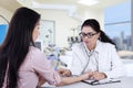 Female patient checked by doctor Royalty Free Stock Photo