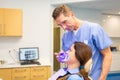 Female patient at dentis teeth whitening procedure Royalty Free Stock Photo