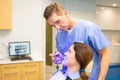 Female patient at dentis teeth whitening procedure Royalty Free Stock Photo