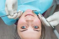 Female patient at dentist examination, closeup portrait, beautiful woman smiling, view from above. Royalty Free Stock Photo