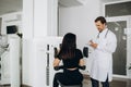 Female patient examining spine at physiotherapist at vertebrology center