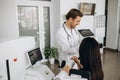 Female patient examining spine at physiotherapist at vertebrology center