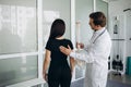 Female patient examining spine at physiotherapist at vertebrology center