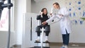 Female patient examining spine at physiotherapist at vertebrology center.