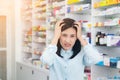 Female patient having head ache background  pharmacy. Woman feeling unwell Healthcare and medical concept Royalty Free Stock Photo